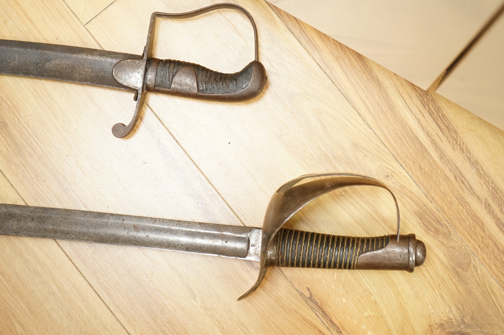Two swords; a 1796 pattern cavalry troopers regulation pattern sword, the blade stamped W. Deakin, with government inspector’s mark, and regulation hilt, in fair condition, well worn with some light pitting, together wit
